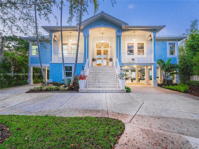 view of front of home featuring french doors and covered porch