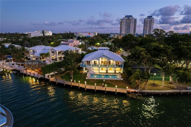 aerial view at dusk with a water view