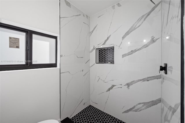 full bath featuring a marble finish shower