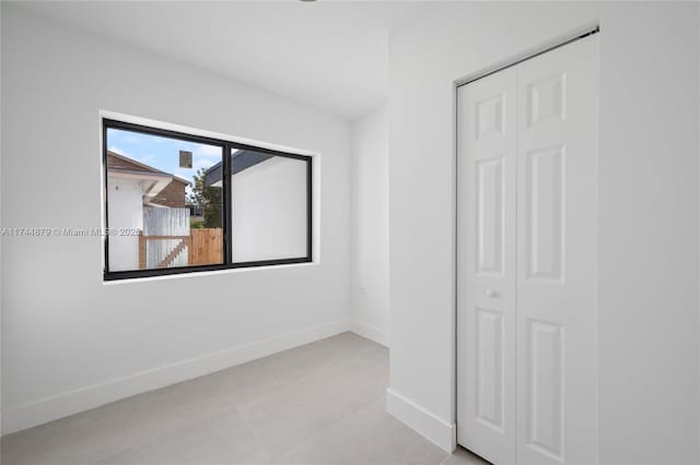 empty room with baseboards