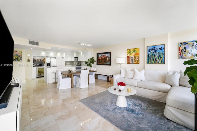 living room with beverage cooler