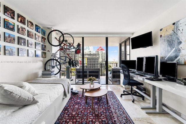 bedroom featuring floor to ceiling windows and access to exterior