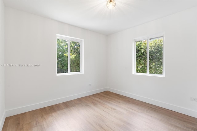 unfurnished bedroom featuring a closet and light wood-type flooring