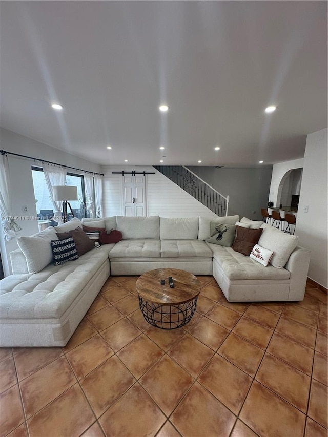 541 NE 199th Ln Unit 2X, Miami, FL 33179 - tiled living room featuring arched walkways and recessed lighting