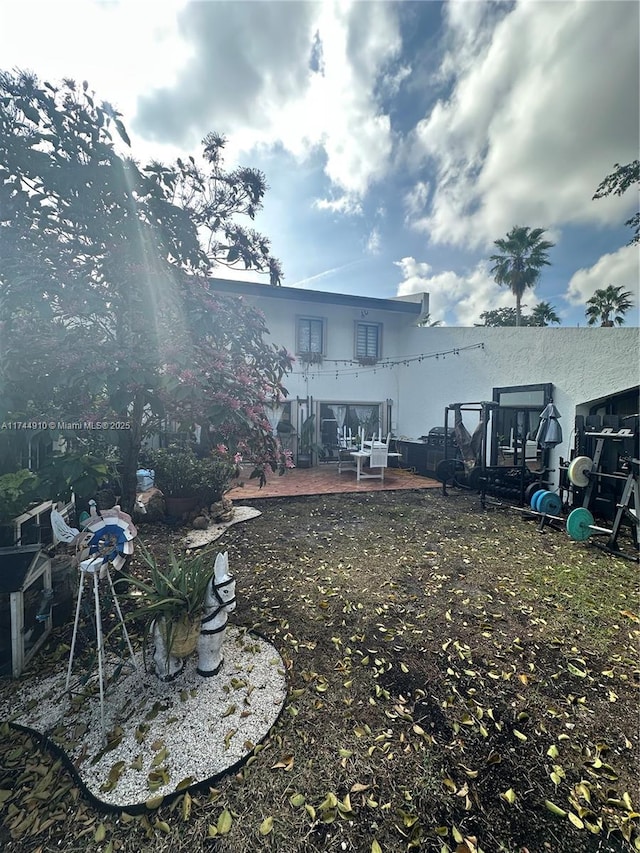 541 NE 199th Ln Unit 2X, Miami, FL 33179 - view of yard featuring a patio area
