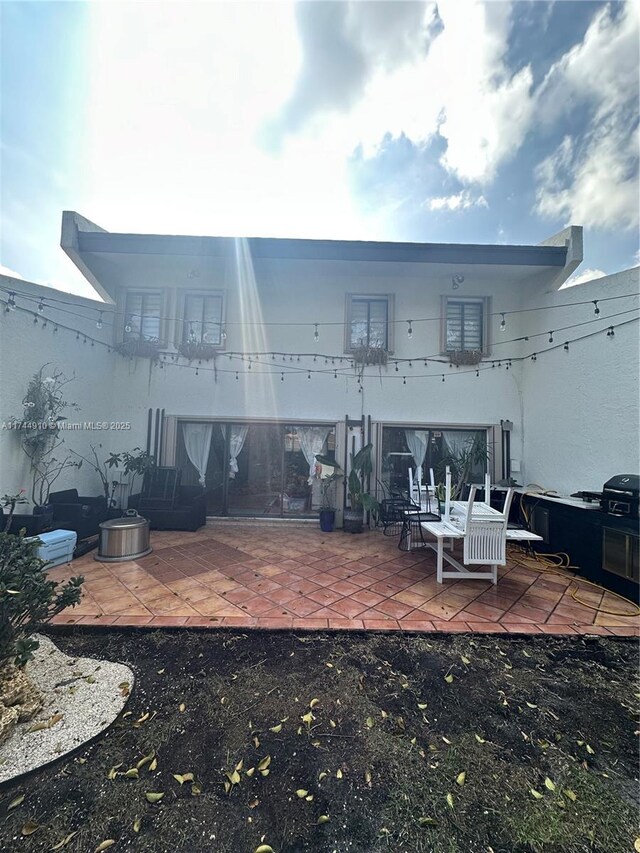 541 NE 199th Ln Unit 2X, Miami, FL 33179 - rear view of house featuring a patio area