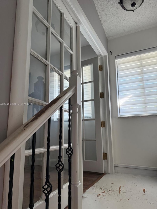 541 NE 199th Ln Unit 2X, Miami, FL 33179 - entryway with baseboards and a textured ceiling