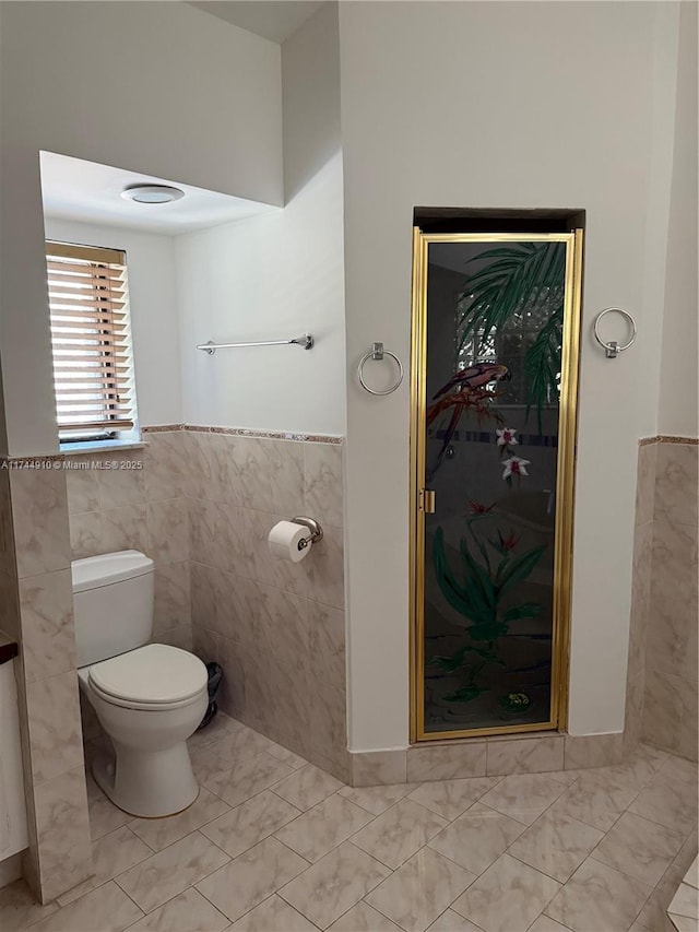 541 NE 199th Ln Unit 2X, Miami, FL 33179 - bathroom featuring tile walls, a wainscoted wall, and toilet