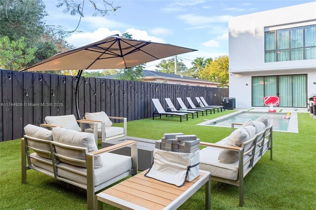 view of patio with outdoor lounge area and a swimming pool