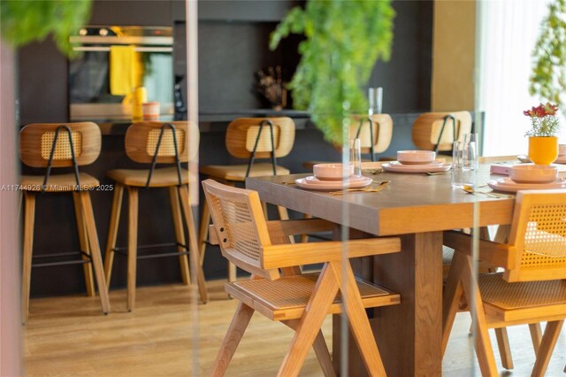 dining area featuring light wood-type flooring