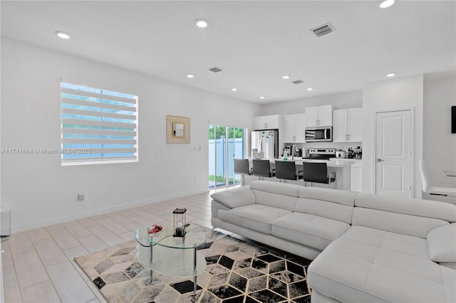 living room with light hardwood / wood-style flooring