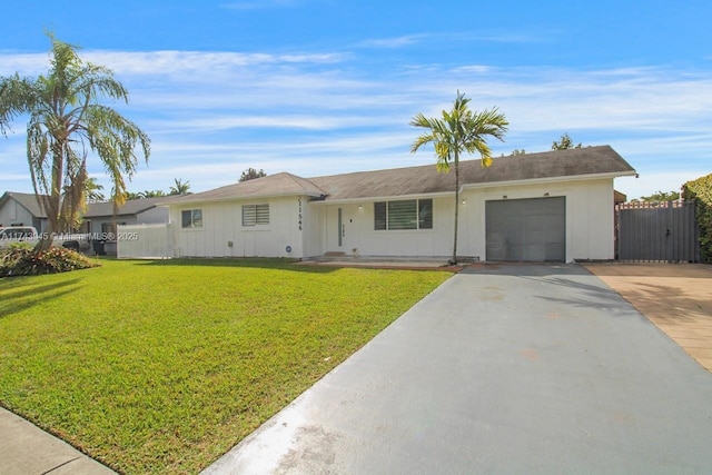 ranch-style house with a garage and a front yard