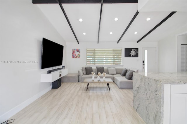 living room with vaulted ceiling with beams and light hardwood / wood-style floors