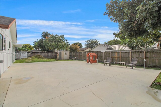 view of patio / terrace featuring a storage unit