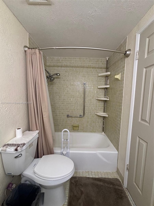 bathroom featuring shower / tub combo, tile patterned floors, a textured ceiling, and toilet