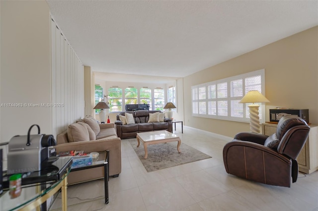 tiled living area with baseboards