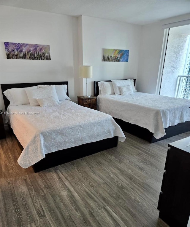 bedroom with hardwood / wood-style flooring