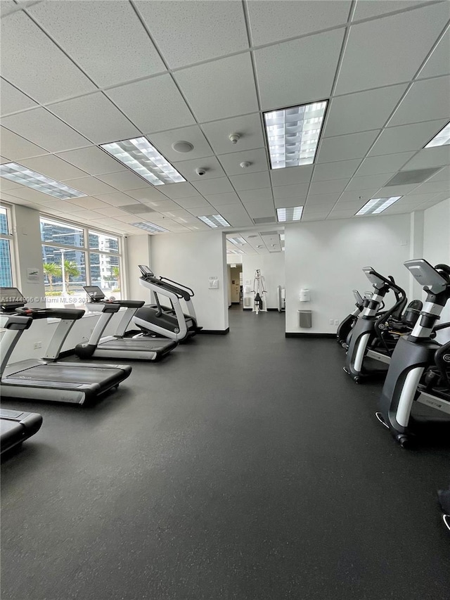 exercise room with a paneled ceiling