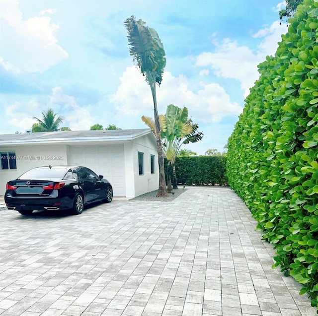 view of side of property with a garage