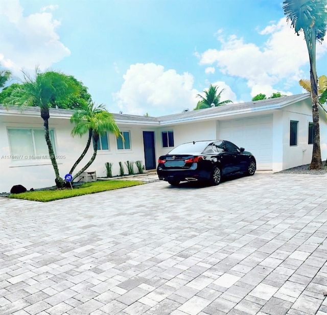 single story home featuring a garage