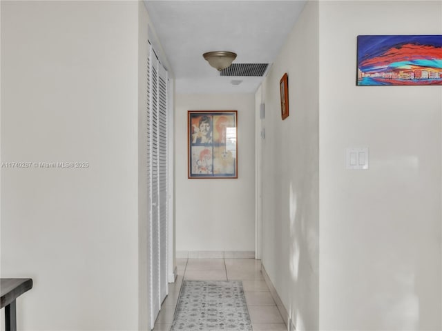 hall with light tile patterned flooring