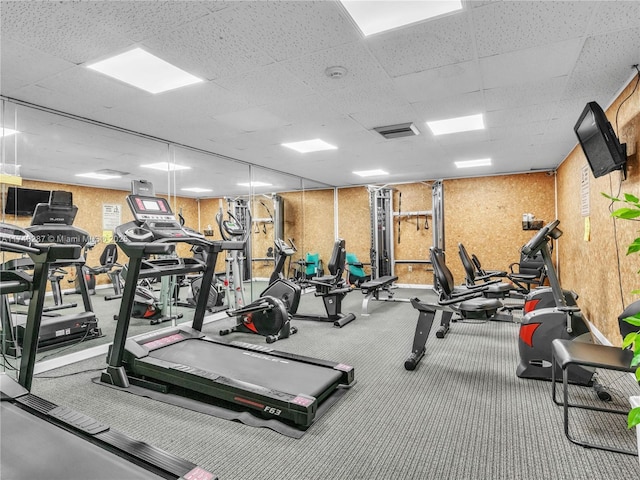 gym featuring a paneled ceiling