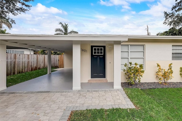 entrance to property featuring a carport