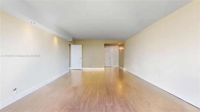 unfurnished room featuring light wood-type flooring