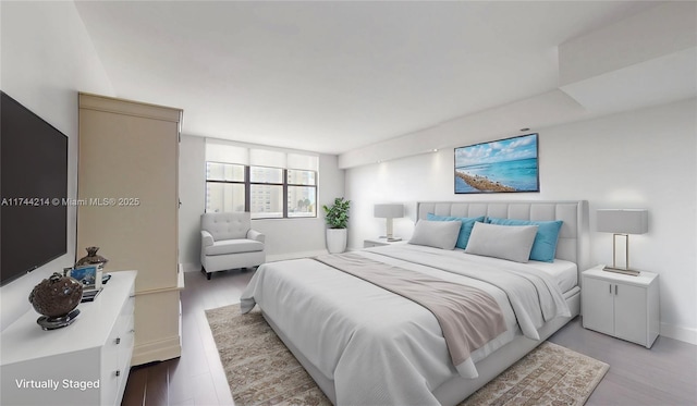 bedroom with light wood-type flooring