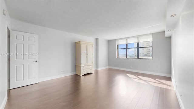 unfurnished bedroom featuring hardwood / wood-style flooring