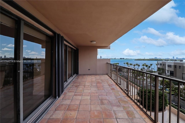 balcony featuring a water view