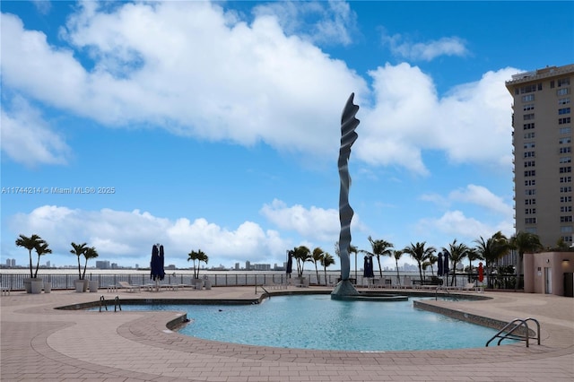 view of swimming pool featuring a patio area