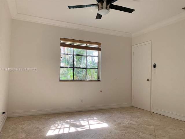 spare room featuring ornamental molding and ceiling fan