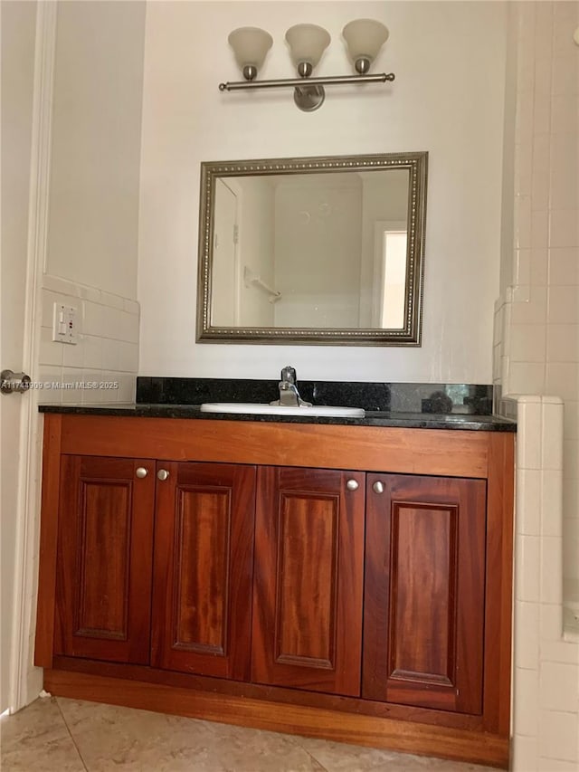 bathroom featuring vanity and tile patterned flooring