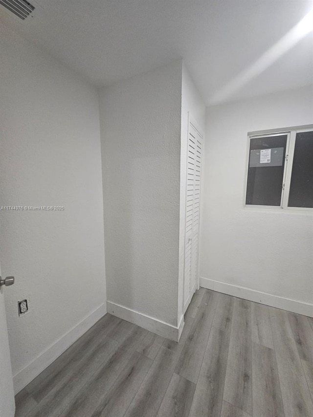 spare room featuring light wood-type flooring