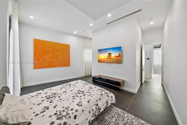 bedroom with dark tile patterned flooring