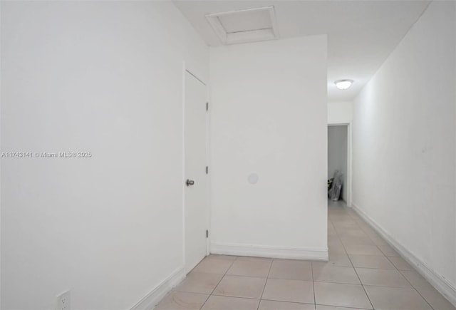 hallway with light tile patterned flooring