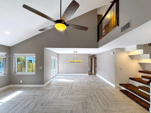 unfurnished living room featuring ceiling fan, high vaulted ceiling, and light parquet floors