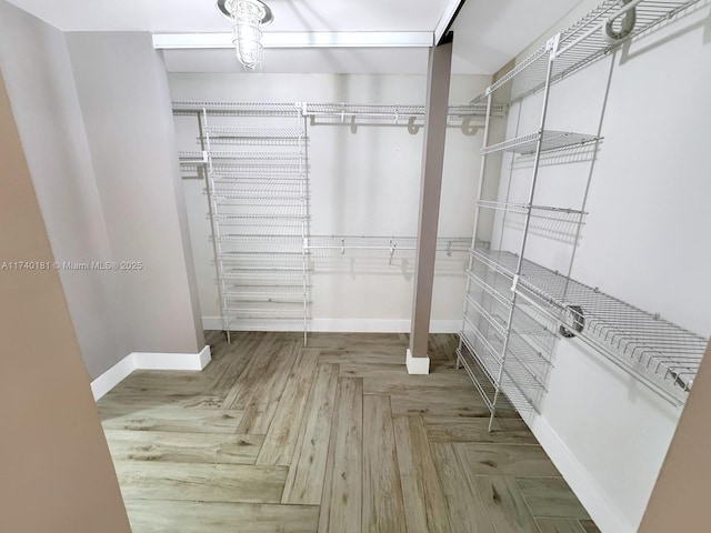 spacious closet with parquet floors