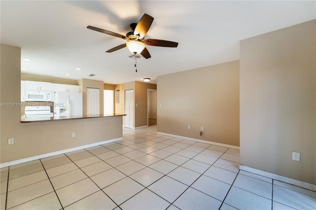 unfurnished room with light tile patterned floors, ceiling fan, baseboards, and recessed lighting