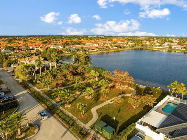 birds eye view of property featuring a water view and a residential view