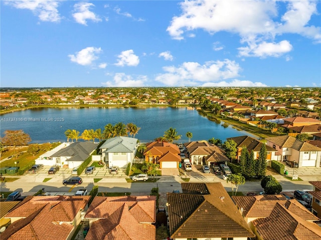 birds eye view of property featuring a residential view and a water view