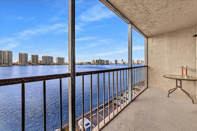 balcony featuring a water view