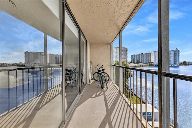 balcony featuring a water view