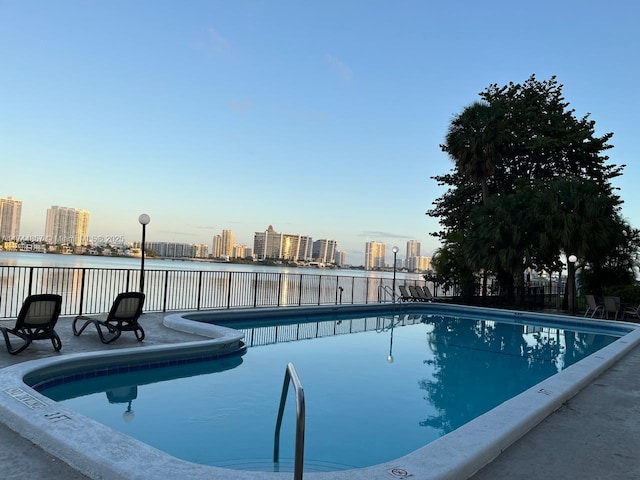 view of pool with a water view