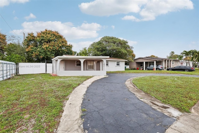 ranch-style house with a front yard