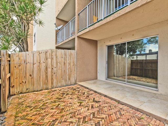 view of patio featuring fence