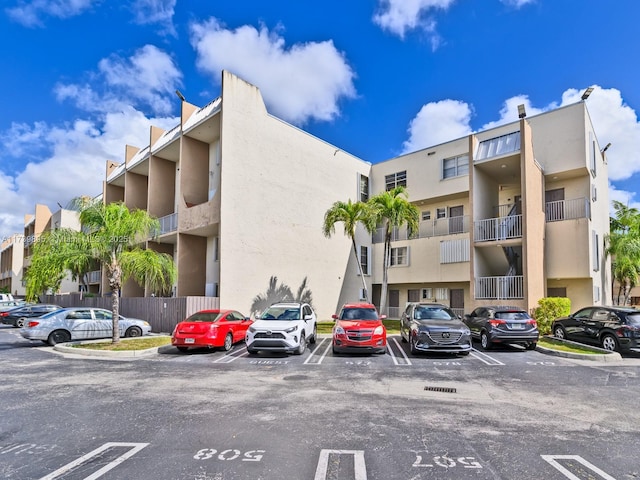 view of property with uncovered parking