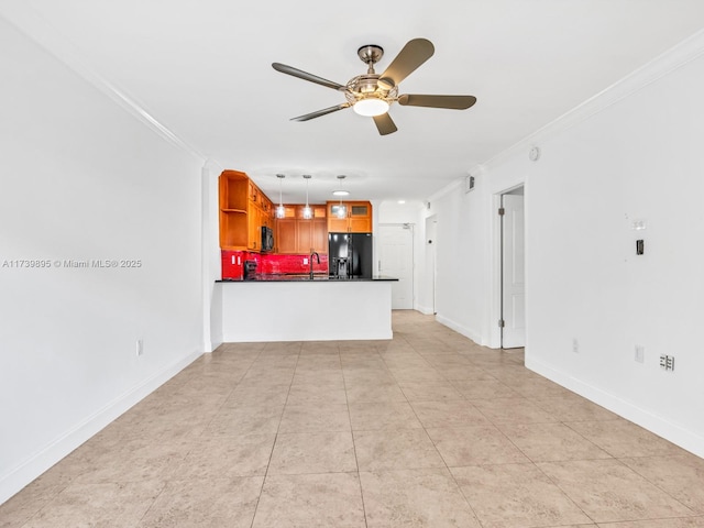 unfurnished living room with light tile patterned floors, a ceiling fan, baseboards, and ornamental molding