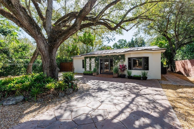 exterior space featuring cooling unit and french doors